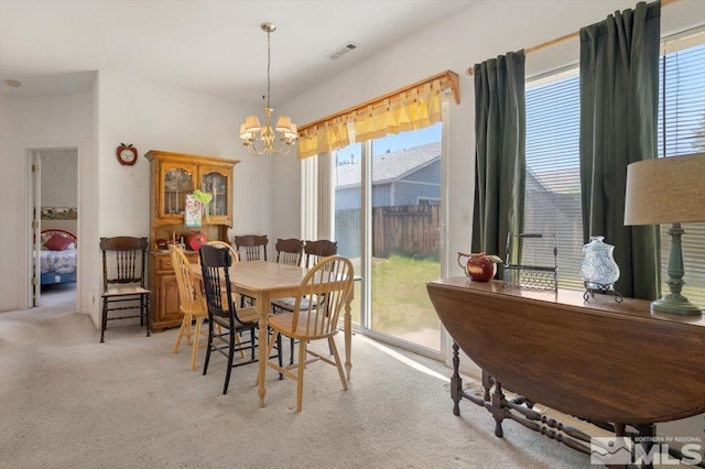 10010 Purple Sage Dr, Reno, NV 89506 - dining area with healthy amount of natural light, a chandelier, and carpet floors