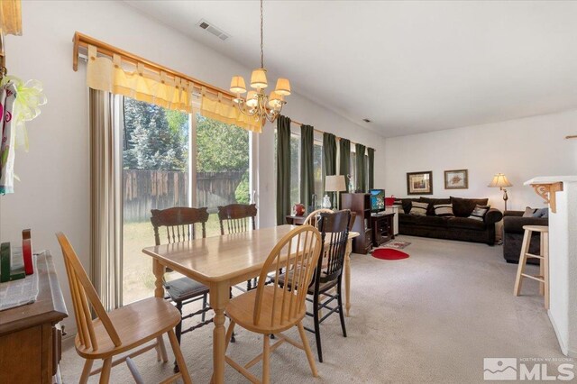 10010 Purple Sage Dr, Reno, NV 89506 - dining room featuring a chandelier and light carpet