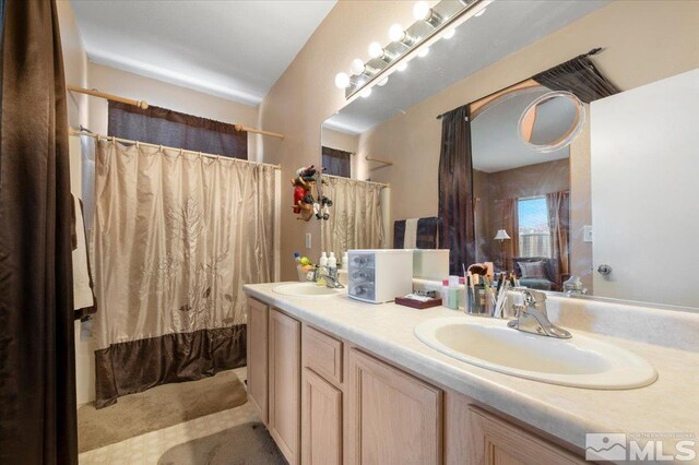 10010 Purple Sage Dr, Reno, NV 89506 - bathroom with curtained shower and double vanity