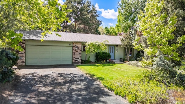 12565 Creek Crest Dr, Reno, NV 89511 - single story home featuring an attached garage, brick siding, asphalt driveway, a front yard, and a chimney