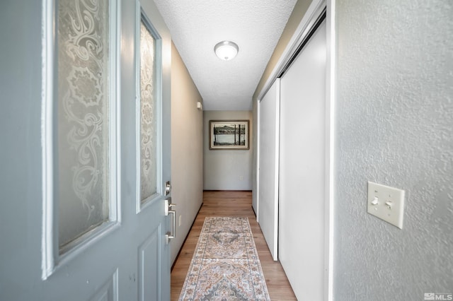 12565 Creek Crest Dr, Reno, NV 89511 - doorway featuring light wood-type flooring and a textured ceiling