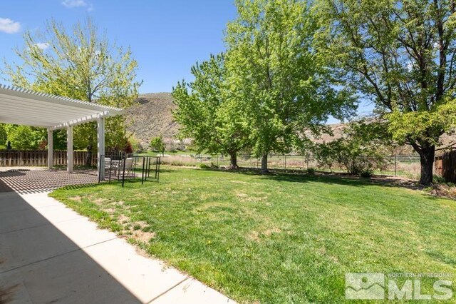 5979 Hidden Highlands Dr, Reno, NV 89502 - view of yard featuring a pergola, a patio area, and a mountain view
