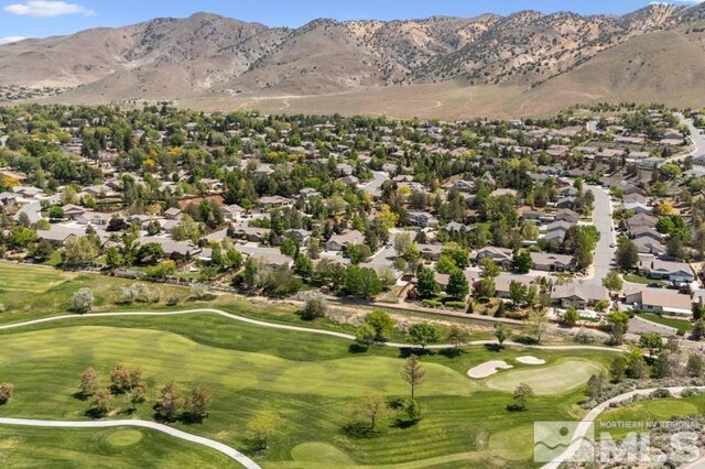 5979 Hidden Highlands Dr, Reno, NV 89502 - aerial overview of property's location with a local golf course, mountains, and nearby suburban area