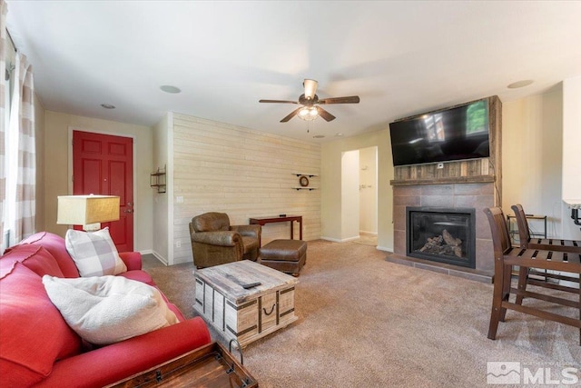 9185 Raytheon Ct, Reno, NV 89506 - carpeted living area featuring a ceiling fan, a fireplace, and baseboards
