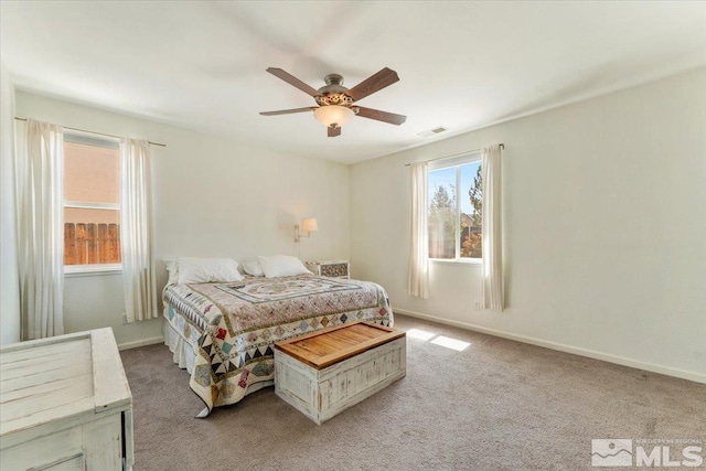 9185 Raytheon Ct, Reno, NV 89506 - bedroom with light carpet, ceiling fan, and baseboards