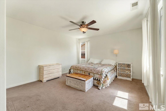 9185 Raytheon Ct, Reno, NV 89506 - bedroom with light colored carpet, a ceiling fan, and baseboards