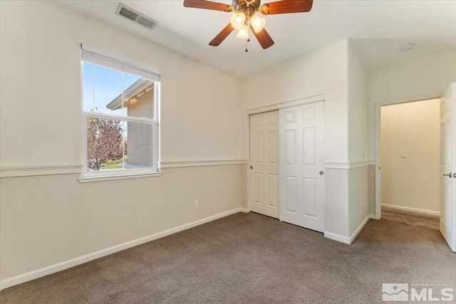 9185 Raytheon Ct, Reno, NV 89506 - unfurnished bedroom with carpet, baseboards, a closet, and a ceiling fan