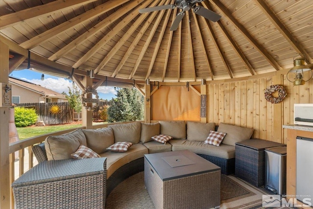 9185 Raytheon Ct, Reno, NV 89506 - wooden deck featuring ceiling fan, fence, outdoor lounge area, and a gazebo
