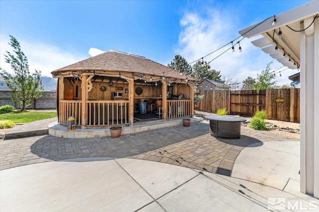 9185 Raytheon Ct, Reno, NV 89506 - view of patio / terrace featuring a gazebo and a fenced backyard