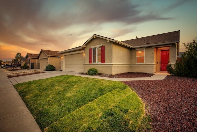 9185 Raytheon Ct, Reno, NV 89506 - ranch-style house featuring concrete driveway, a front lawn, stucco siding, and an attached garage