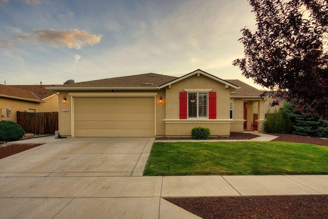 9185 Raytheon Ct, Reno, NV 89506 - ranch-style home with concrete driveway, stucco siding, and an attached garage