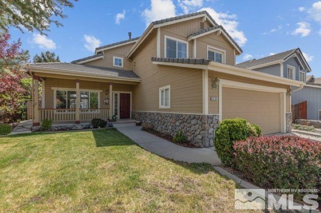 5284 Tappan Ct, Reno, NV 89523 - craftsman inspired home featuring stone siding, a front lawn, a porch, and a garage