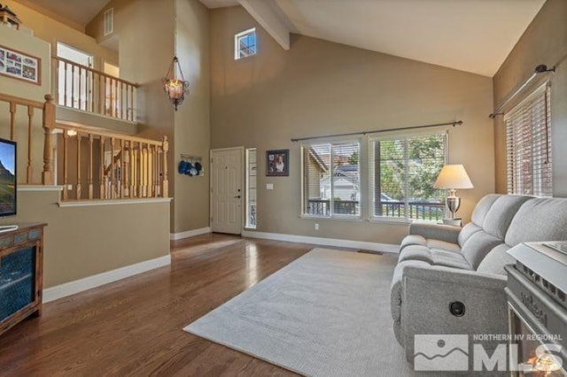 5284 Tappan Ct, Reno, NV 89523 - living room with wood finished floors, high vaulted ceiling, baseboards, and beamed ceiling