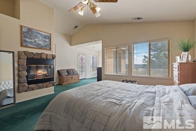 5284 Tappan Ct, Reno, NV 89523 - carpeted bedroom featuring a fireplace, vaulted ceiling, ceiling fan, and access to outside