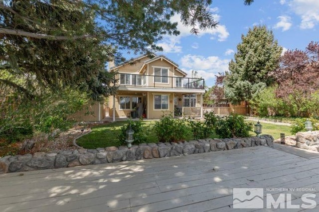 5284 Tappan Ct, Reno, NV 89523 - rear view of house featuring a balcony, fence, and a wooden deck
