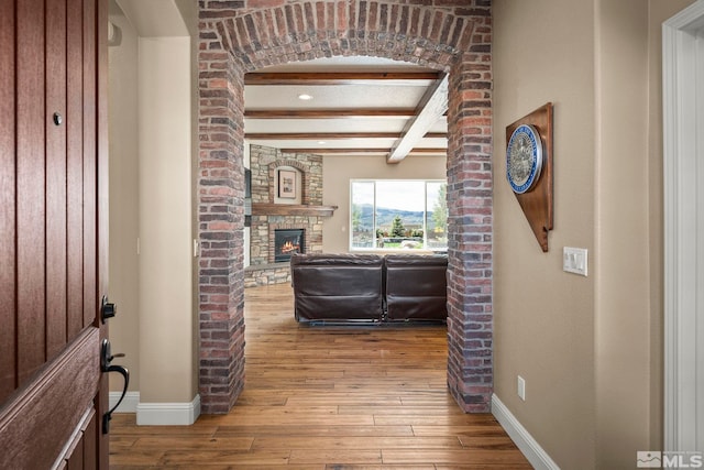 9825 Hayfield Dr, Sparks, NV 89441 - hallway with beamed ceiling, baseboards, and hardwood / wood-style flooring