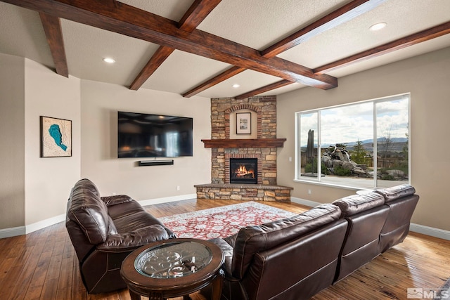 9825 Hayfield Dr, Sparks, NV 89441 - living area featuring hardwood / wood-style floors, baseboards, beam ceiling, recessed lighting, and a fireplace