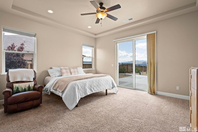 9825 Hayfield Dr, Sparks, NV 89441 - carpeted bedroom featuring a raised ceiling, access to outside, recessed lighting, baseboards, and ceiling fan