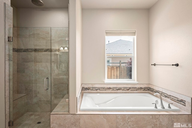 9825 Hayfield Dr, Sparks, NV 89441 - bathroom featuring a stall shower and a bath