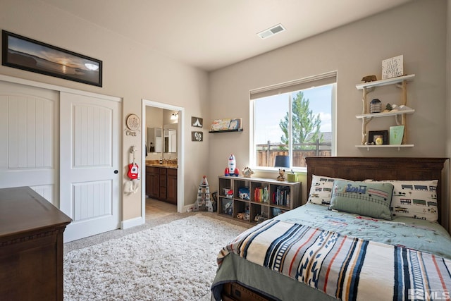 9825 Hayfield Dr, Sparks, NV 89441 - carpeted bedroom featuring baseboards, connected bathroom, and a closet