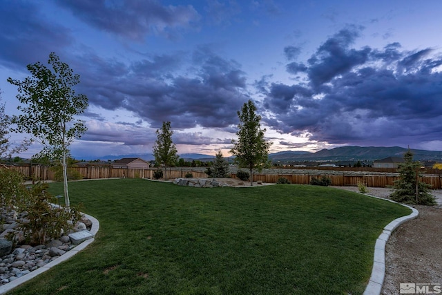 9825 Hayfield Dr, Sparks, NV 89441 - yard at dusk with a mountain view