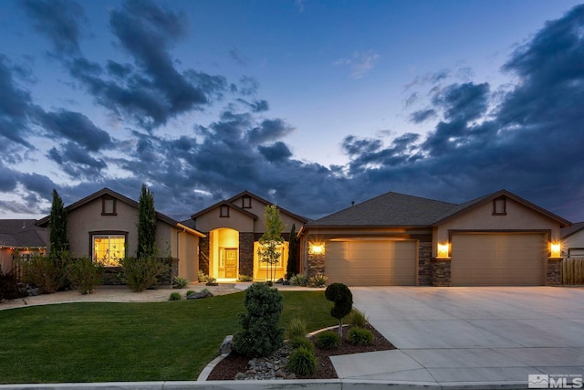 9825 Hayfield Dr, Sparks, NV 89441 - view of front facade featuring stucco siding, a garage, a front yard, concrete driveway, and stone siding