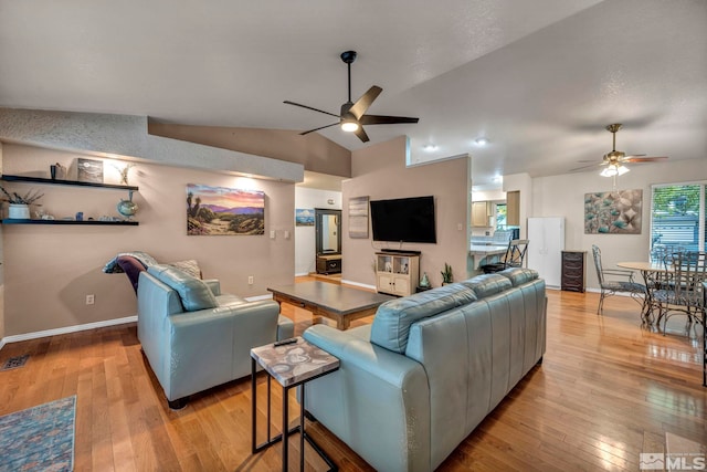 5190 Orinda Dr, Sparks, NV 89436 - living area with ceiling fan, lofted ceiling, light wood-type flooring, and baseboards