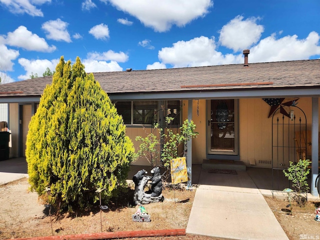 17385 Egret Ln, Reno, NV 89508 - entrance to property featuring a shingled roof