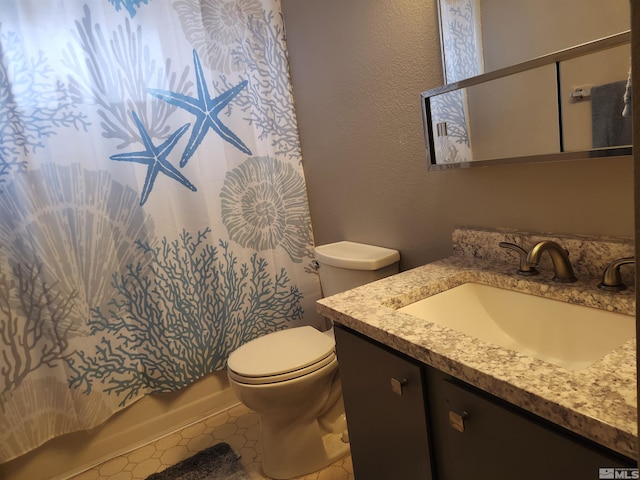 17385 Egret Ln, Reno, NV 89508 - bathroom featuring toilet, vanity, a textured wall, and shower / tub combo with curtain