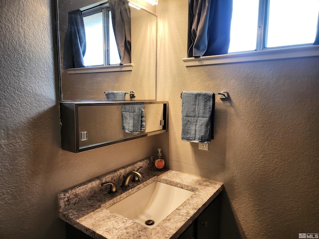 17385 Egret Ln, Reno, NV 89508 - bathroom with a textured wall and vanity