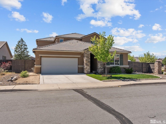 2401 Bridgetown Loop, Sparks, NV 89436 - traditional home with a garage, stucco siding, concrete driveway, a tiled roof, and fence