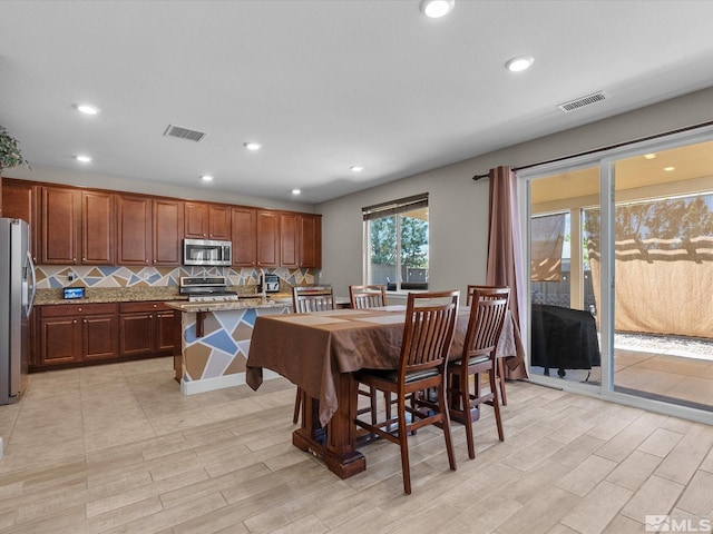 2401 Bridgetown Loop, Sparks, NV 89436 - dining area featuring light wood-type flooring and recessed lighting