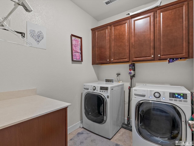 2401 Bridgetown Loop, Sparks, NV 89436 - clothes washing area featuring cabinet space, washing machine and clothes dryer, baseboards, and light tile patterned floors