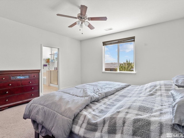 2401 Bridgetown Loop, Sparks, NV 89436 - bedroom with light carpet, a ceiling fan, and connected bathroom
