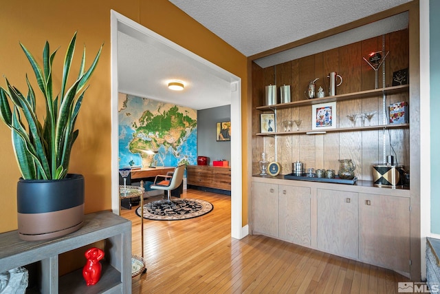 2135 Skyline Blvd, Reno, NV 89509 - dining area with a textured ceiling, light wood-style flooring, and wallpapered walls