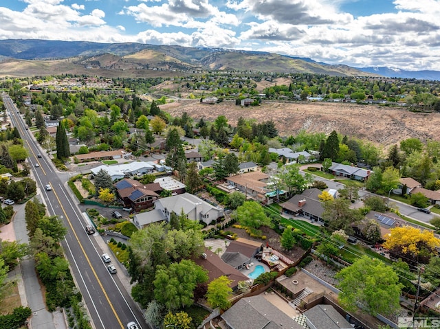 aerial perspective of suburban area featuring a mountainous background