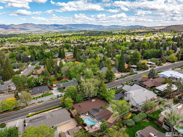 aerial perspective of suburban area with a mountain backdrop
