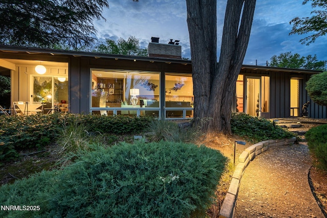 2135 Skyline Blvd, Reno, NV 89509 - back of house featuring board and batten siding and a chimney