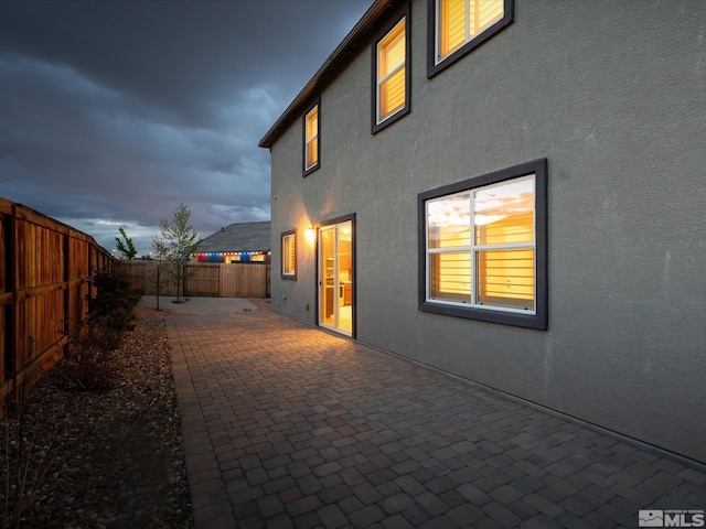 213 Enclave Key Ct, Reno, NV 89506 - back of property with stucco siding, a patio area, and a fenced backyard