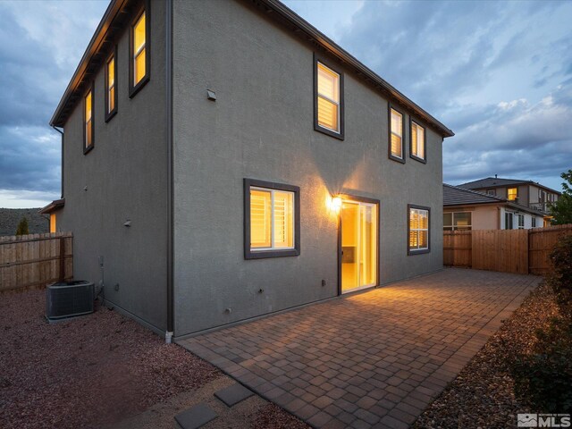 213 Enclave Key Ct, Reno, NV 89506 - rear view of property with a patio area, stucco siding, and central AC unit