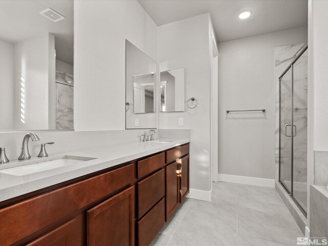 213 Enclave Key Ct, Reno, NV 89506 - full bath featuring a stall shower, double vanity, tile patterned flooring, recessed lighting, and baseboards