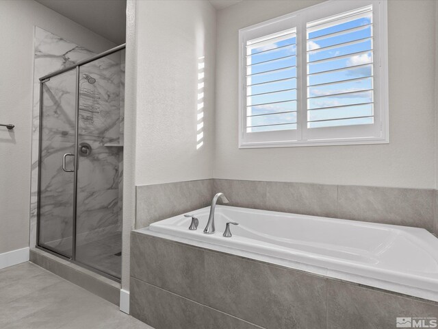 213 Enclave Key Ct, Reno, NV 89506 - bathroom featuring a marble finish shower and a garden tub