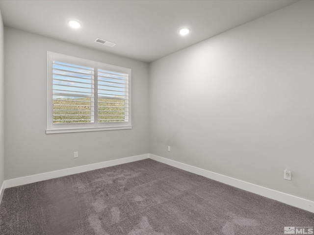 213 Enclave Key Ct, Reno, NV 89506 - empty room with dark colored carpet, recessed lighting, and baseboards