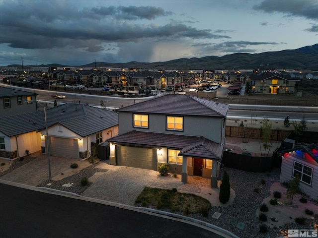 213 Enclave Key Ct, Reno, NV 89506 - view of front of home with a mountain view, driveway, a residential view, and fence