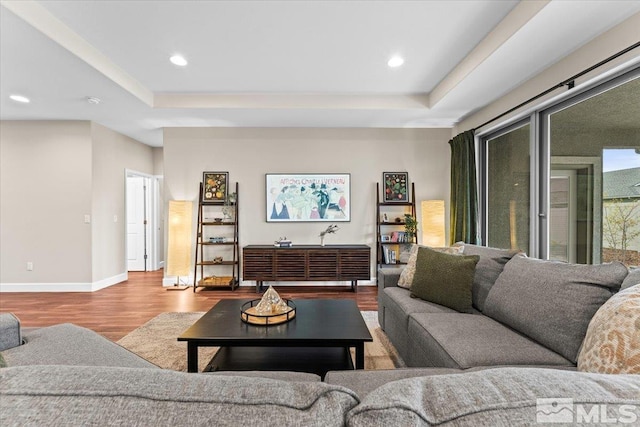 11129 Bandero Heights Ln, Reno, NV 89521 - living room featuring wood finished floors, baseboards, a raised ceiling, and recessed lighting