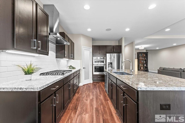 11129 Bandero Heights Ln, Reno, NV 89521 - kitchen featuring a sink, stainless steel appliances, dark wood-style flooring, dark brown cabinetry, and tasteful backsplash