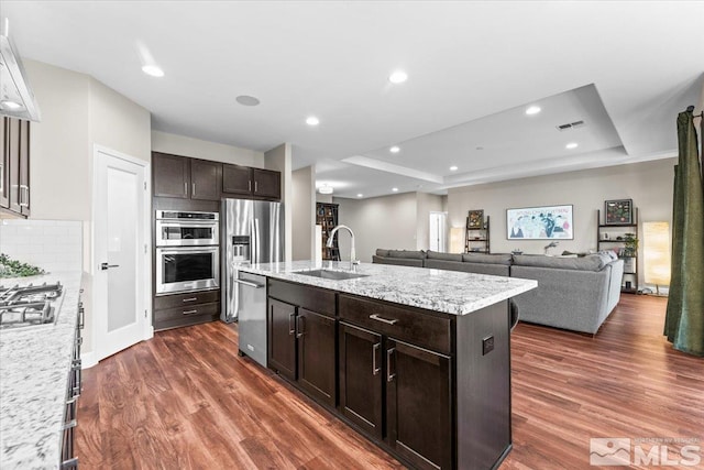 11129 Bandero Heights Ln, Reno, NV 89521 - kitchen featuring a sink, stainless steel appliances, dark wood-style floors, dark brown cabinetry, and recessed lighting
