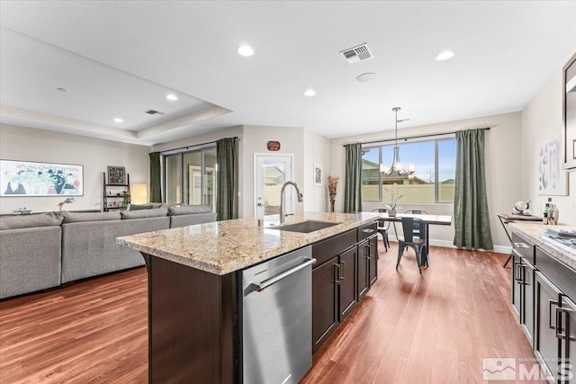11129 Bandero Heights Ln, Reno, NV 89521 - kitchen with dishwasher, a sink, wood finished floors, recessed lighting, and dark brown cabinetry
