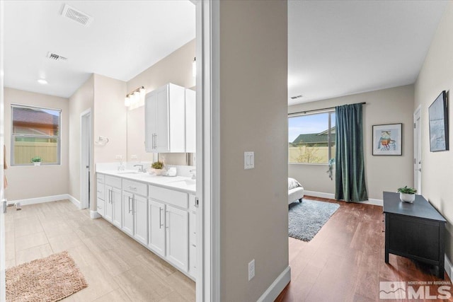 11129 Bandero Heights Ln, Reno, NV 89521 - ensuite bathroom with baseboards and double vanity