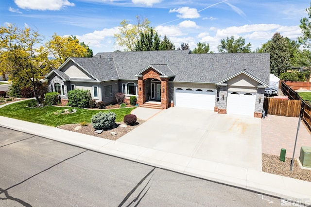971 Fieldgate Way, Gardnerville, NV 89460 - single story home featuring an attached garage, driveway, brick siding, and stone siding